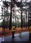 Tony using a pole saw to clear some limbs from the roads on the Carolina Sandhills NWR.