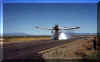 Tanker 498 doing a demonstration drop using water at the Winnemucca Airport in 1996.