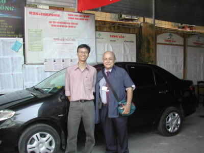 Mr. Balsamo and Mr. Lai Quoc Loc in front of the College