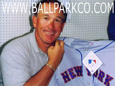 Hall Of Famer Gary Carter holding up one of our jerseys he signed!