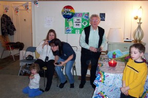 Denis with display in background