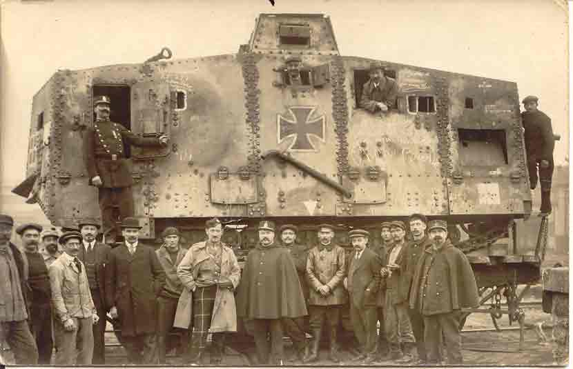 Captured German tank. Note the Scottish officer in front with tartan trousers