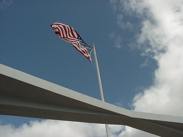 The flag flying over the Arizona Memorial.