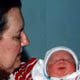 My mom holding her first grandchild