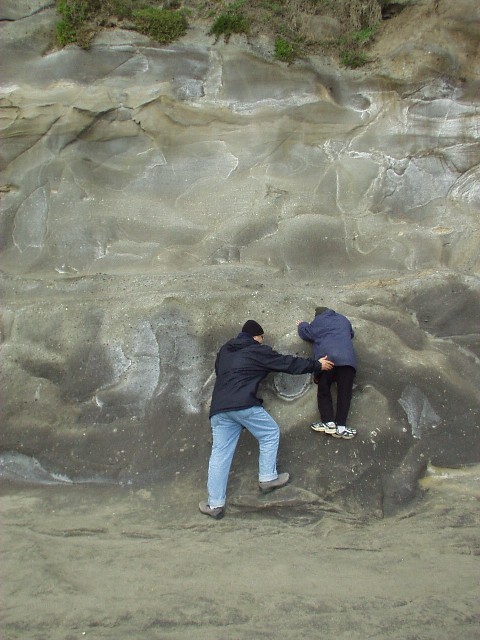 Doron helping Yoav to climb some rocks