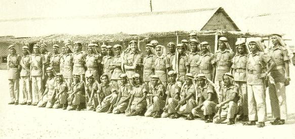 Arab soldiers with their commander at Sharjah headquarters