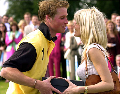 Prince William kisses model Claudia Schiffer after being presented with the Porcelanosa Cup as a member of the winning polo team during a charity polo competition (PA) 