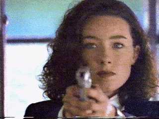 Close up of Molly pointing the gun.