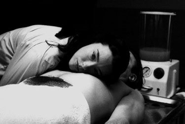 An image of Molly preparing a body for embalmment.