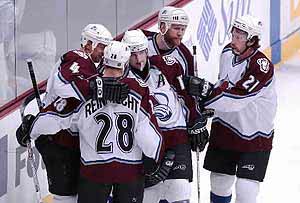 Avalanche center Steven Reinprecht (28) is congratulated on his first period goal by Rob Blake, left, Chris Drury, center, Greg de Vries and Peter Forsberg (21). Col-Det 3-2, 2002-05-26 Photo by Jon Hatch. http://www.dailycamera.com 