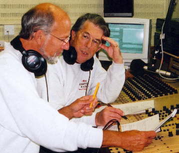 Tel Pearson and co-presenter Robbie Mac working on scripts.