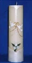 Unity candle decorated with wax doves and gold rings