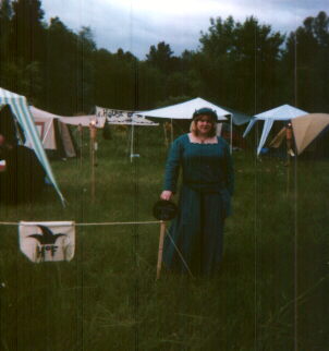 Katherine Wells, posing by the camp entrance