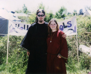 Alder (AKA Bane) and Sara in front of the House Of Fools banner