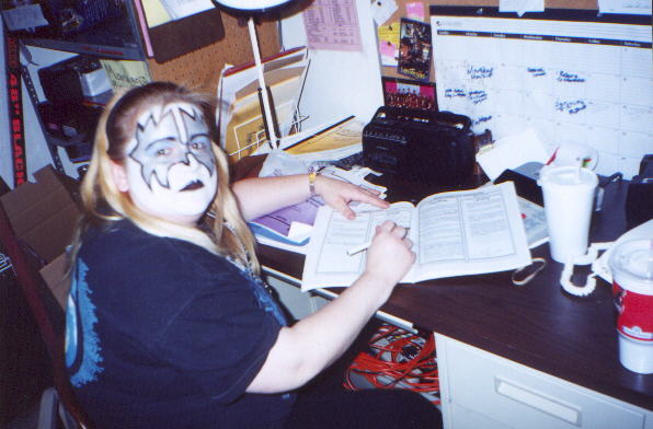 Kate doing some paperwork (as Ace)