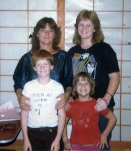My mom, me, Colen and Annie, 1984..I made C&A's shirts..Men At Work and Menudo
