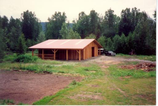 The 100 by 60 foot custom log construction barn