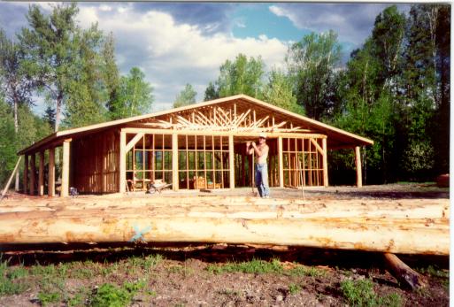 Shows the barn during construction