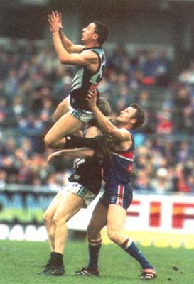 Darren Mead flies for a mark against the Western Bulldogs