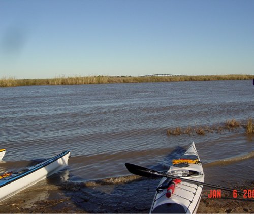 Picture taken at a little sand bar where we stopped to rest.  The take-out bridge is visible in the distance.