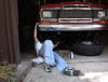me under car putting on lift