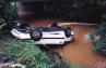 victim ejected and drowned. body came to rest on far side of creek bank. water level was over the vehicle.