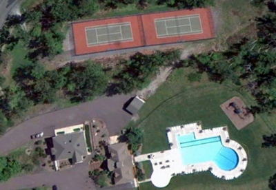 Overhead view of the pool and tennis courts 