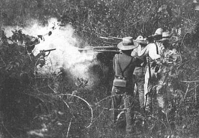 Spanish soldiers firing at Filipino rebels