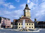 Baroque facades in town square, with medieval Council House, Brasov