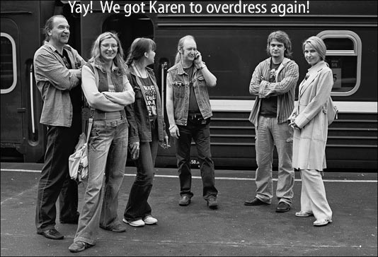 [group of people with one woman dressed very nicely and the rest in jeans]  Yay!  We got Karen to overdress again!
