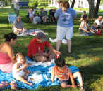 A family group on a picnic blanket