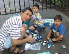 Kin and his boys working on Legos