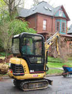 Ron in the catepillar driving to the next site to dig on Kenyon