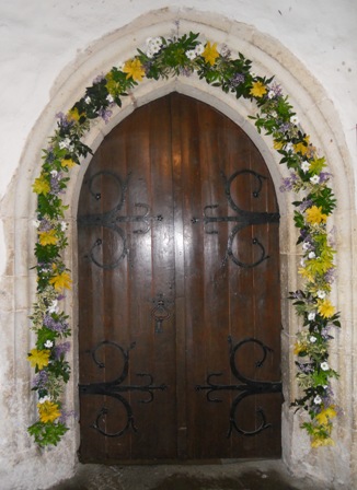 archway decorated with flowers