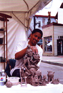 artist making sculpture
