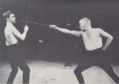 John Castle as Lt. Siczynski and Frederick Jaeger as Lt. Kupfer in the Lemburg gymnasium opening scene