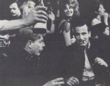 Edward Fox and Maximilian Schell celebrate in Anna's Cafe