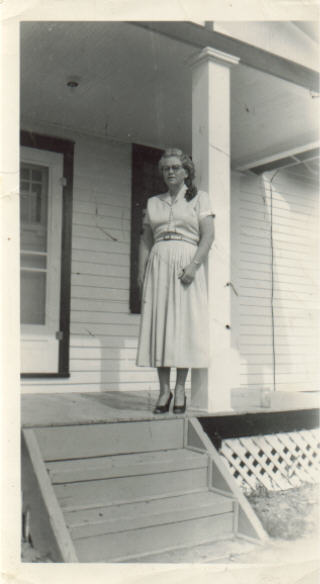 this is my great grandma in frount of her house, if she is the one who is haunting the house, there is nothing to worry about