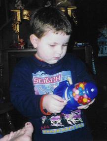 Bryanna observing her new gumball machine...AHH! GUM!