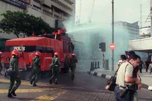 ENSURING SECURITY ... FRU personnel using a water cannon to enforce law and order in Jalan Tuanku Abdul Rahman yesterday.
