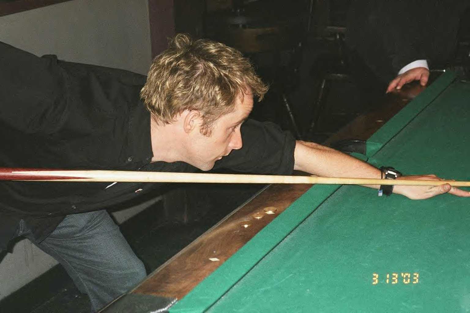 Here he is playing pool