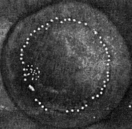 titanium witness plate placed in front of a charged particle beam