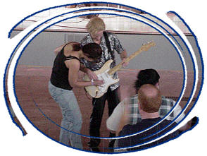 digital image provided by Frankie Sullivan.  Snapshot of Suzanne strumming Frankie's Strat at Seaworld in TX