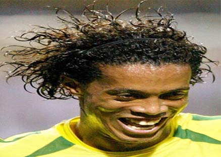Brazil's Ronaldinho celebrates after scoring a penalty kick  against China in the first half of their World Cup Finals in Sogwipo June 8, 2002. REUTERS/Oleg Popov