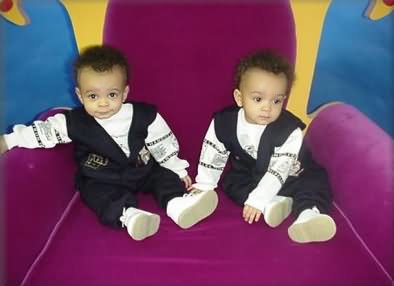 Young elves in Santa's chair