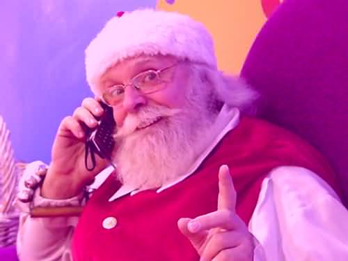 Picture of Santa B Claus talking on cell phone.