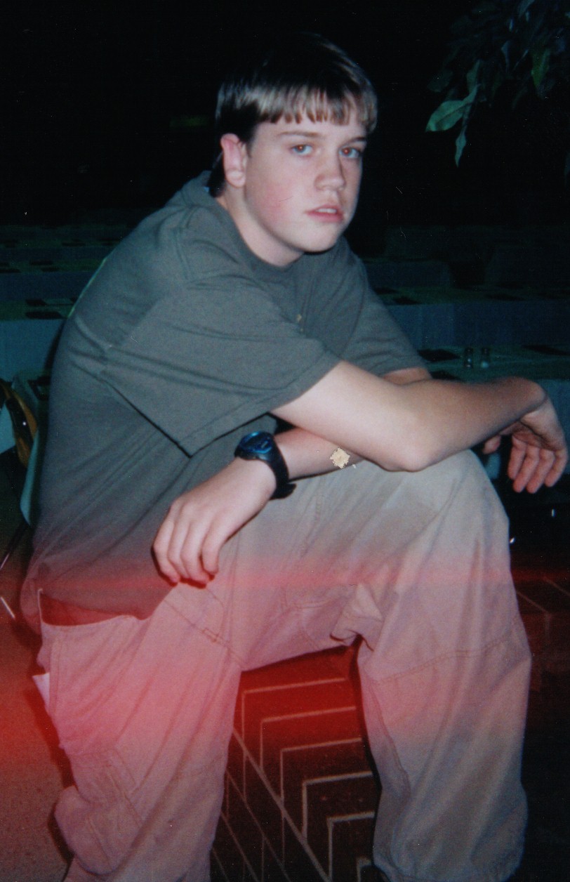 Freshman member Cameron Bentley relaxing at our tournament.  (I don't know what that red stuff is, either.)