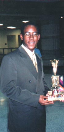 Novice member Josh Hoke poses with his first trophy ever, awarded at TL Hanna.