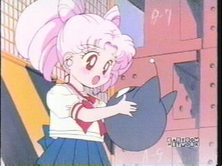 Rini uses the Luna Ball to communicate with Sailor Pluto, her sworn protector.
