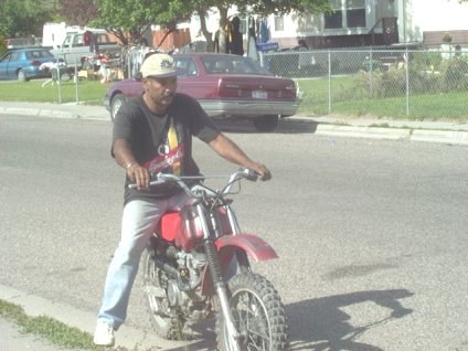 Goofing off on a friend's motor bike.